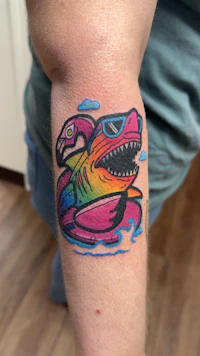 a tattoo of a man in a hat and a hat